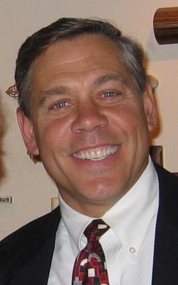 A close-up of a man smiling