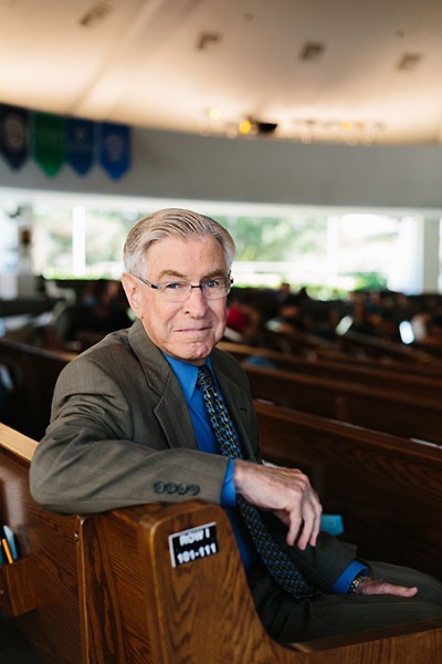 A man sitting in a pew