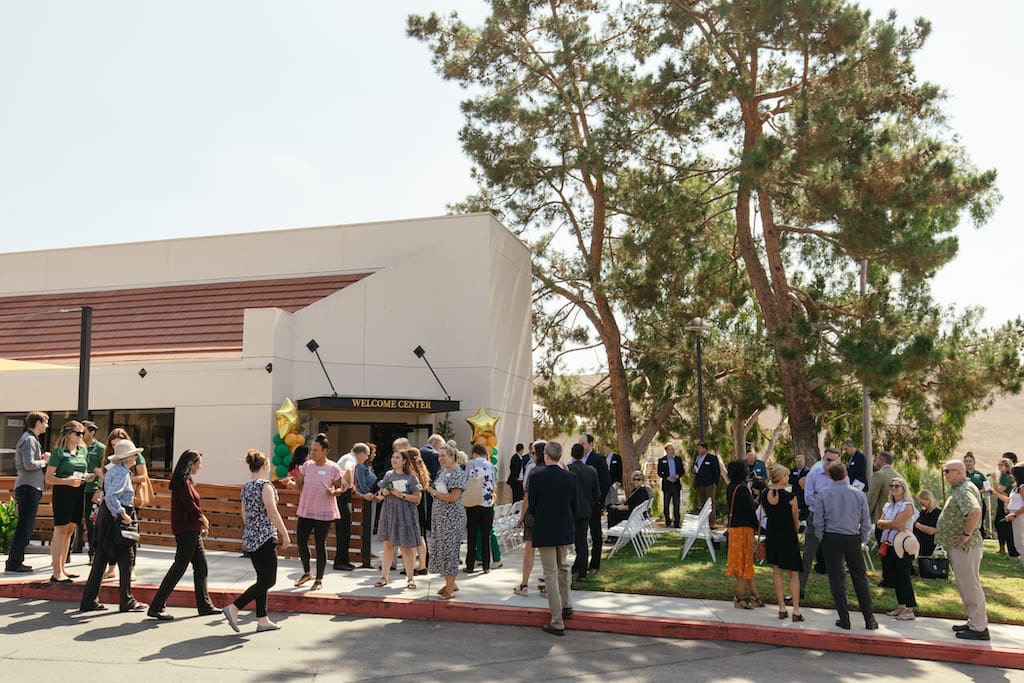 A group of people standing outside a building