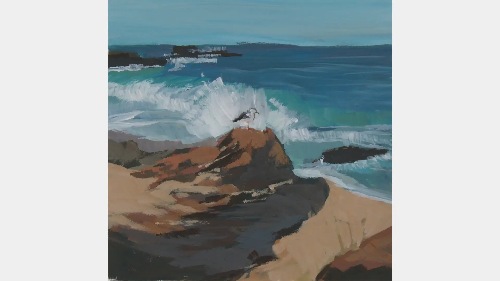 A bird standing on a rock by the ocean