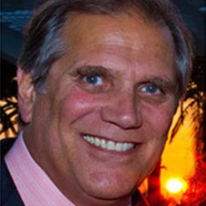 A man smiling at the camera