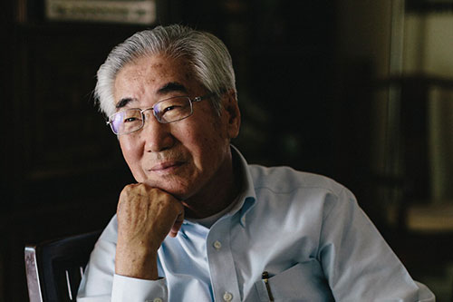 A man with his hand on his chin