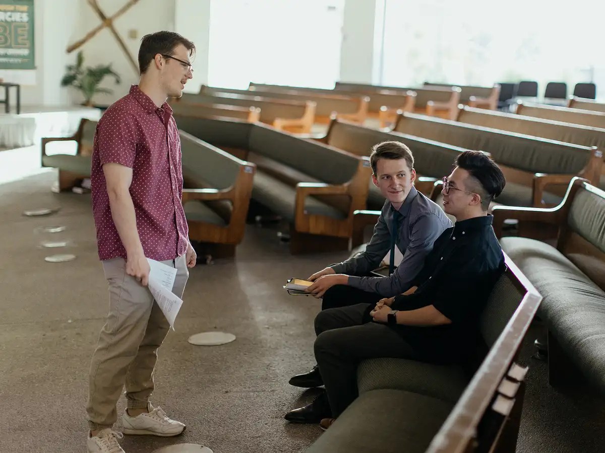 A group of men sitting on a bench