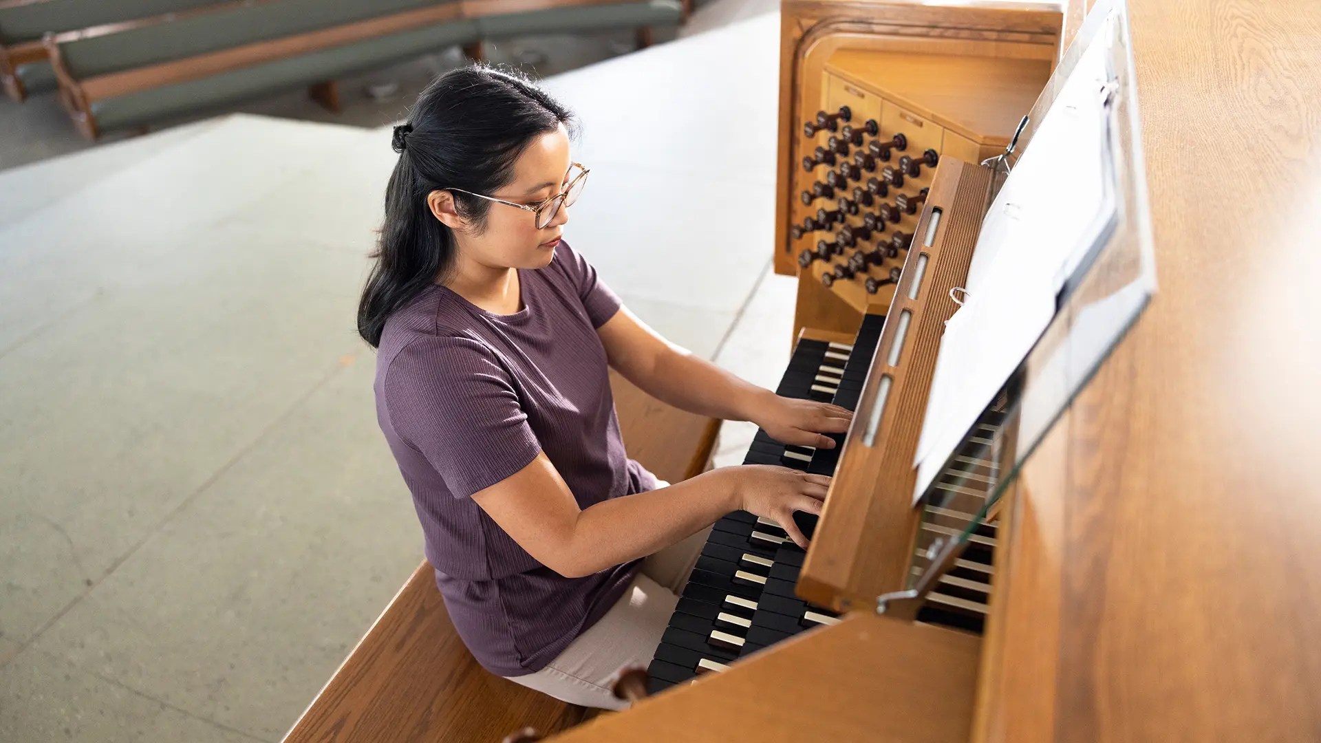 A woman playing a piano