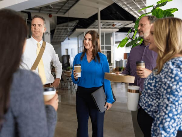A group of people standing in a room
