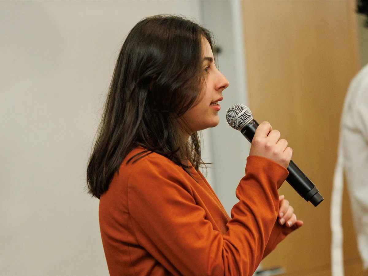 A woman holding a microphone