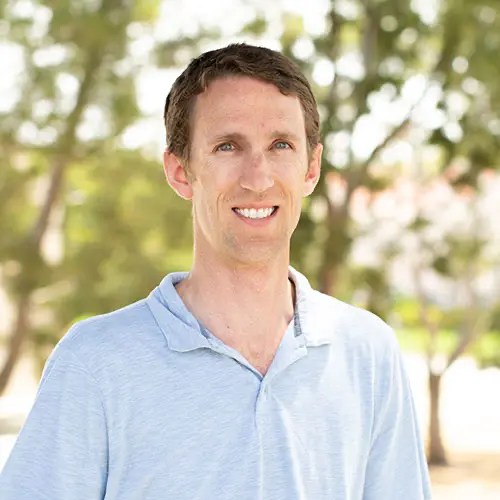 A man smiling for a picture