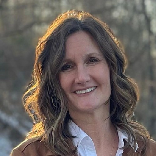 A woman smiling for a picture