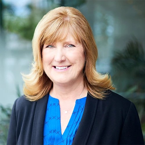 A woman smiling at the camera