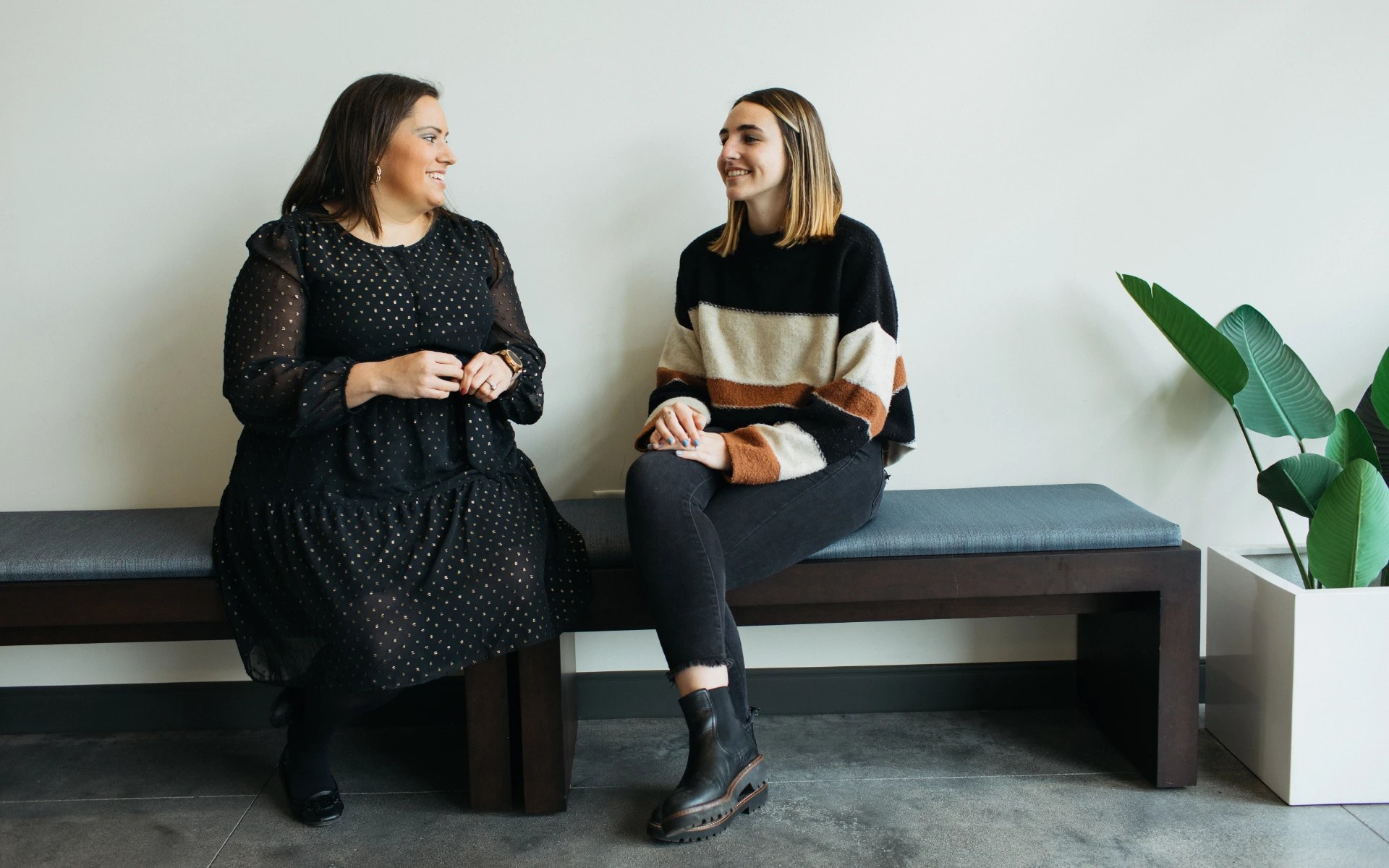 Two women sitting on a bench