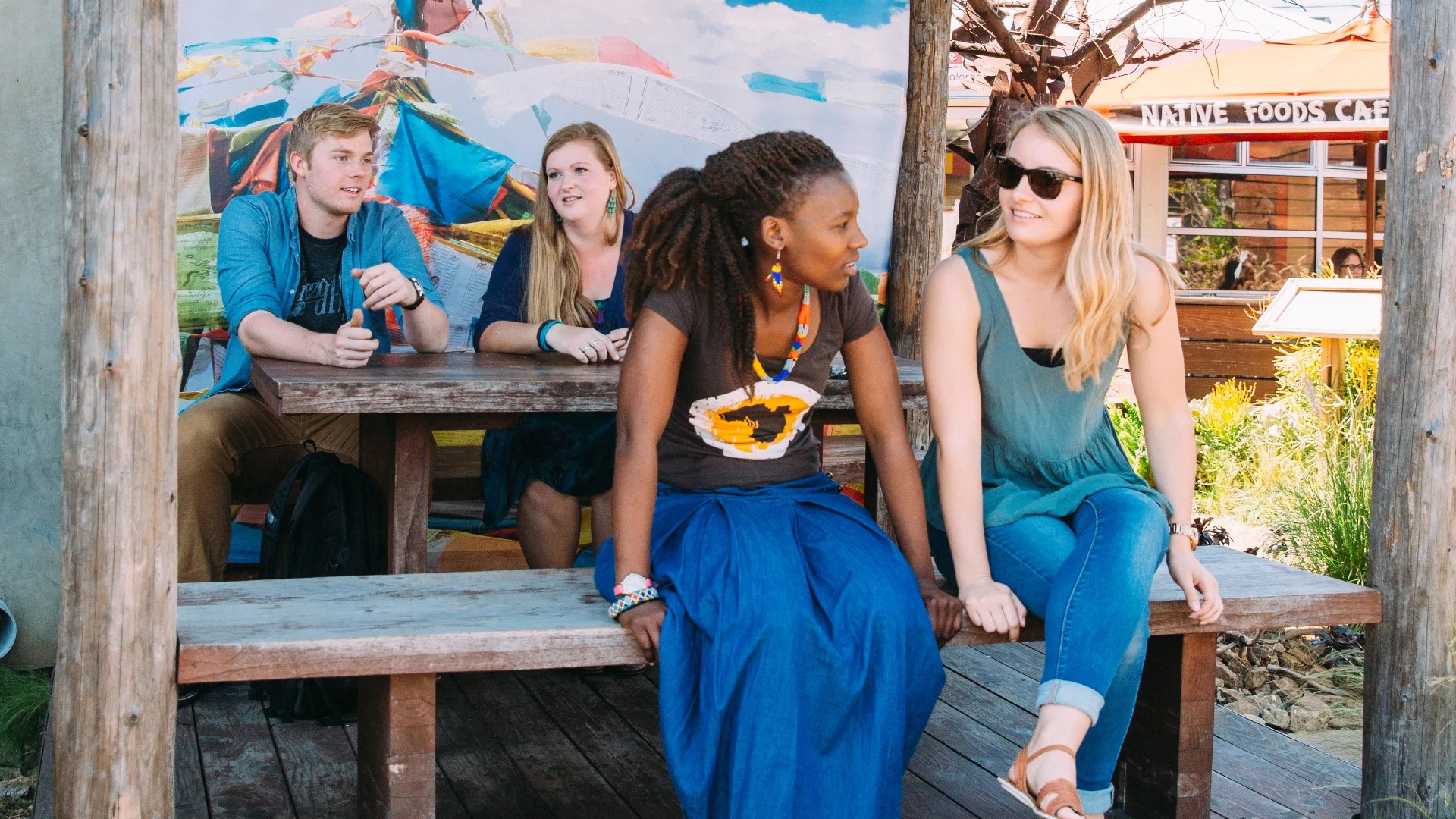 A group of people sitting on a bench
