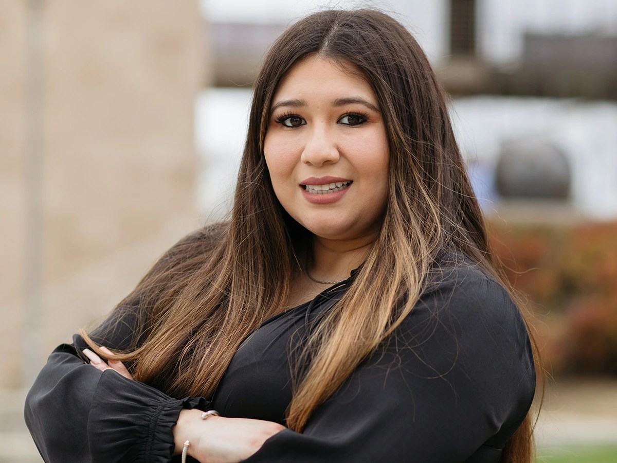 A woman with long hair wearing black shirt