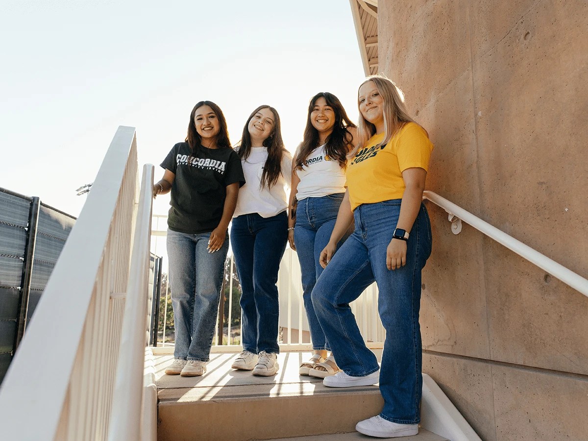 A group of women standing on stairs