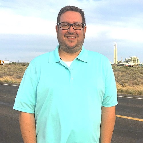 A man standing in the middle of a road