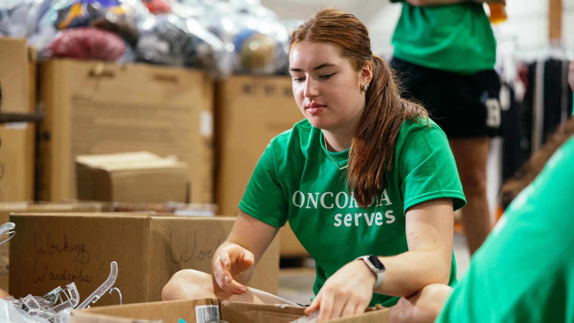 A woman in a green shirt
