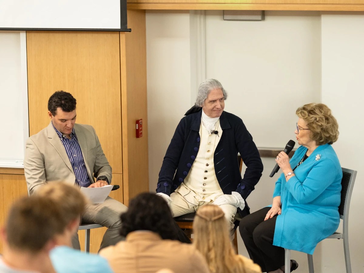 A group of people sitting in a room