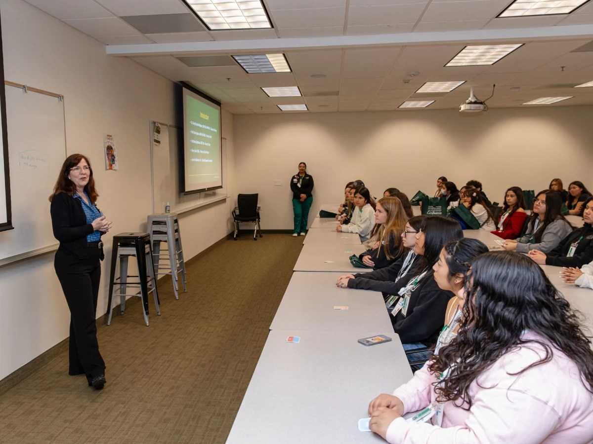 A woman standing in front of a group of people