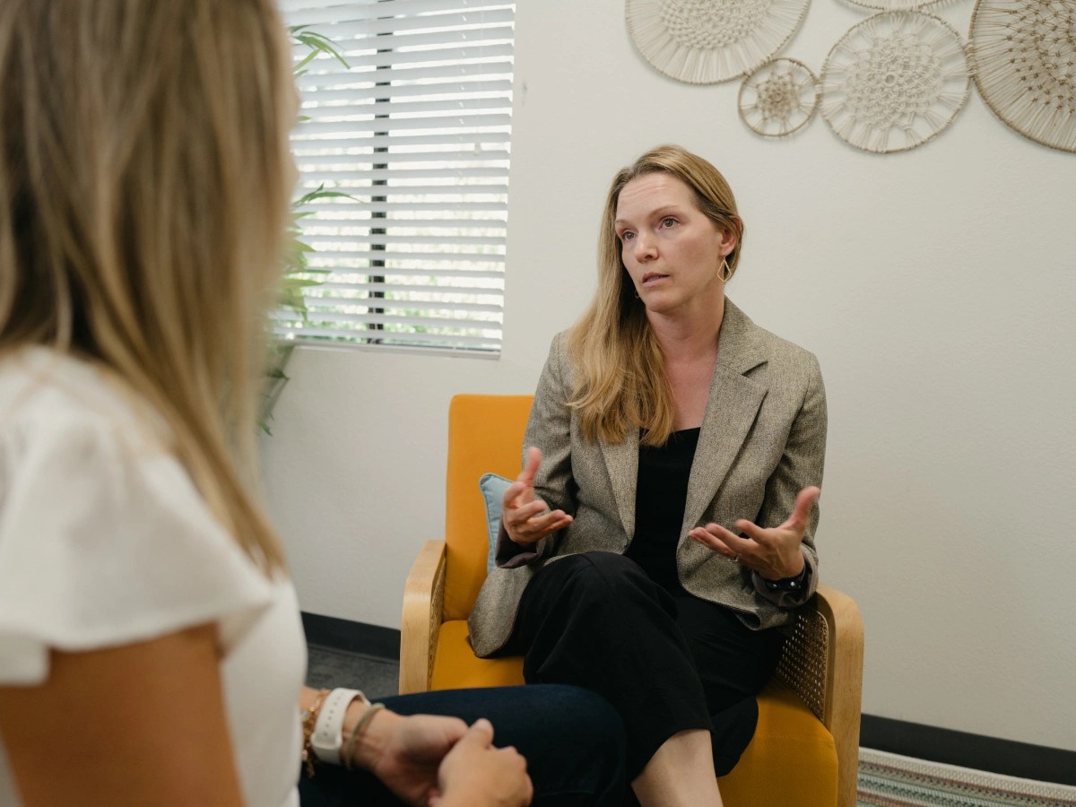 A counselor speaks with another person during a one-on-one session in an office at Concordia University Irvine