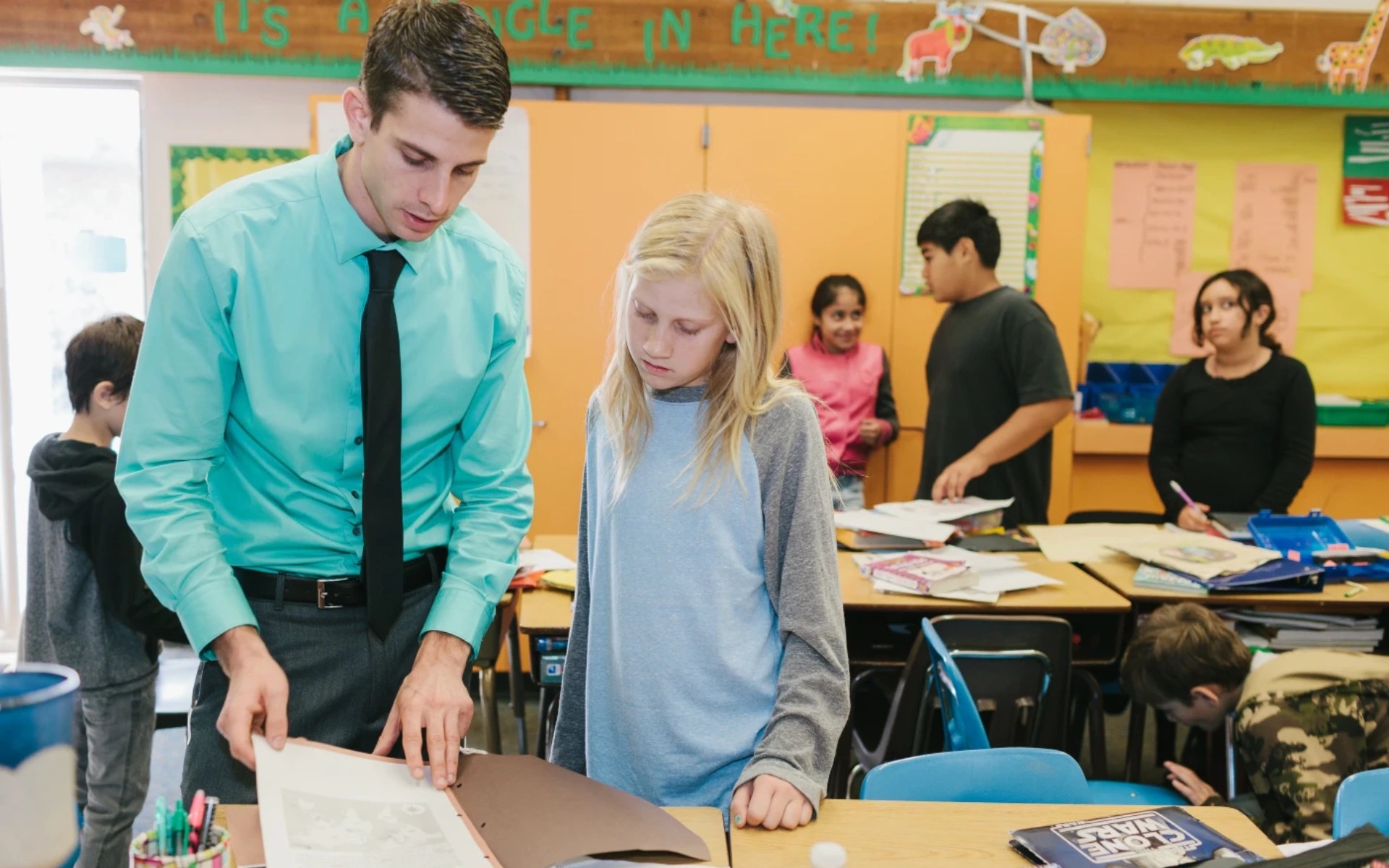 A man and a girl in a classroom