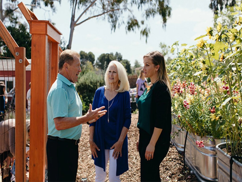 The Vieselmeyers standing in the Heritage Garden