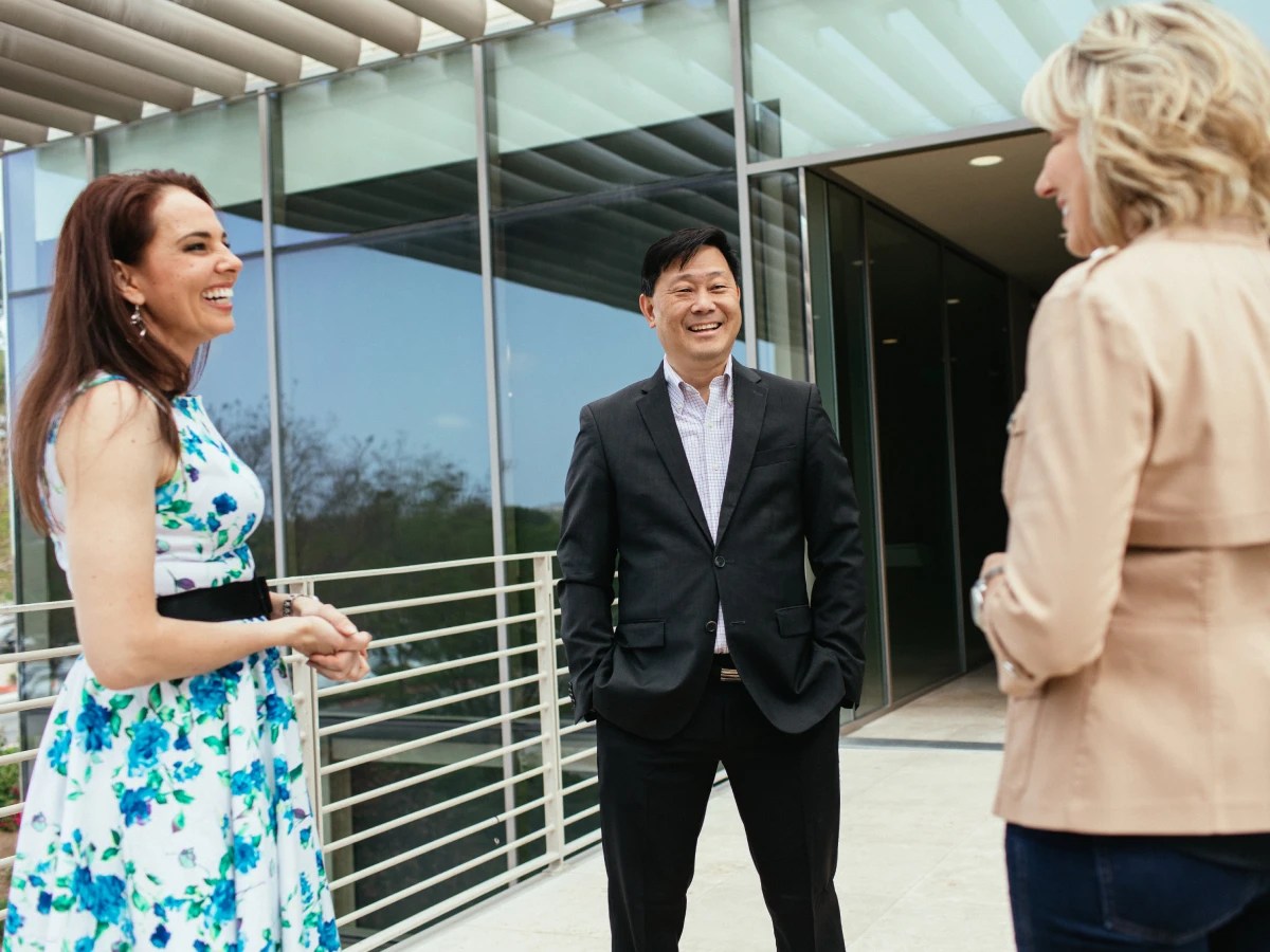 A group of people standing outside a building
