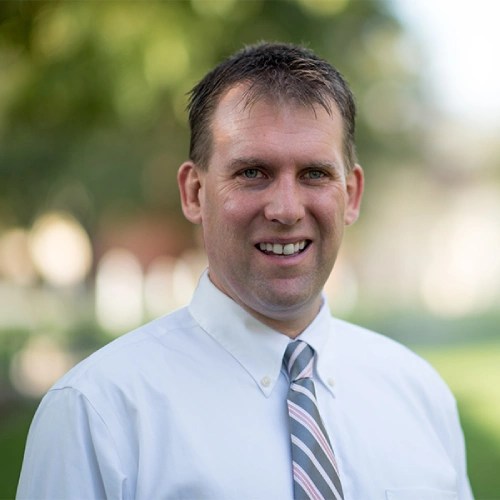 A man in a white shirt and tie