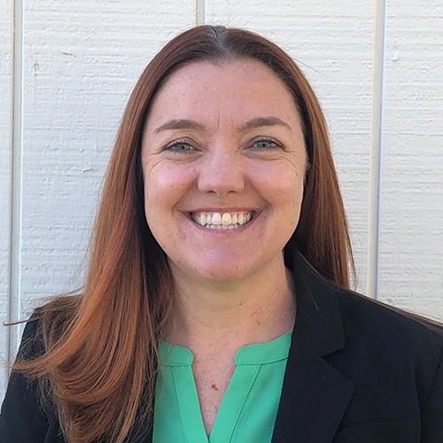 A woman smiling at camera