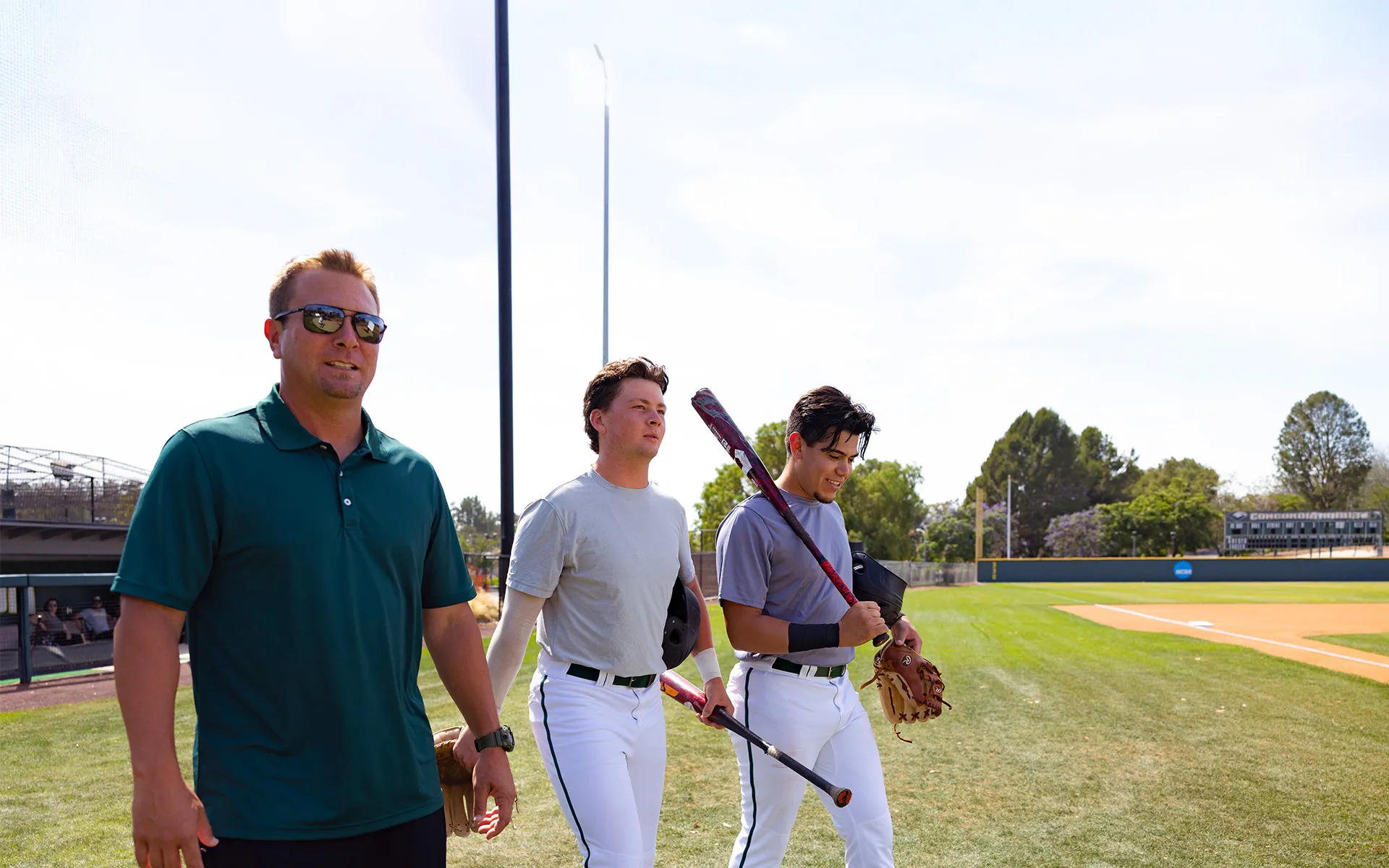 A group of men holding baseball bats
