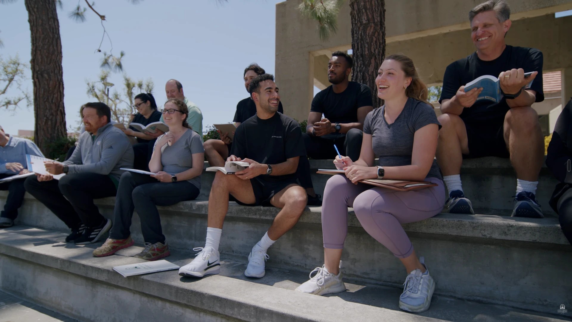 A group of people sitting on steps