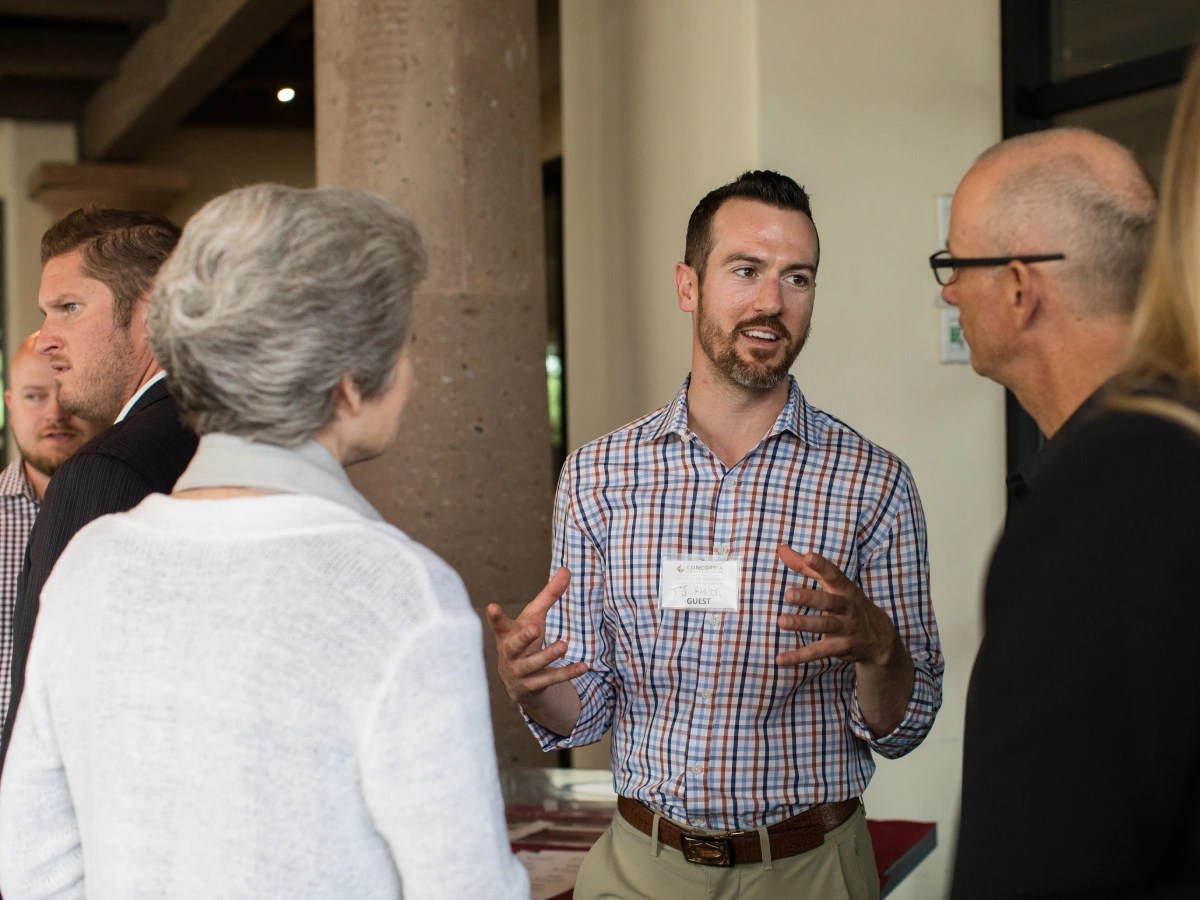 A man talking to a group of people