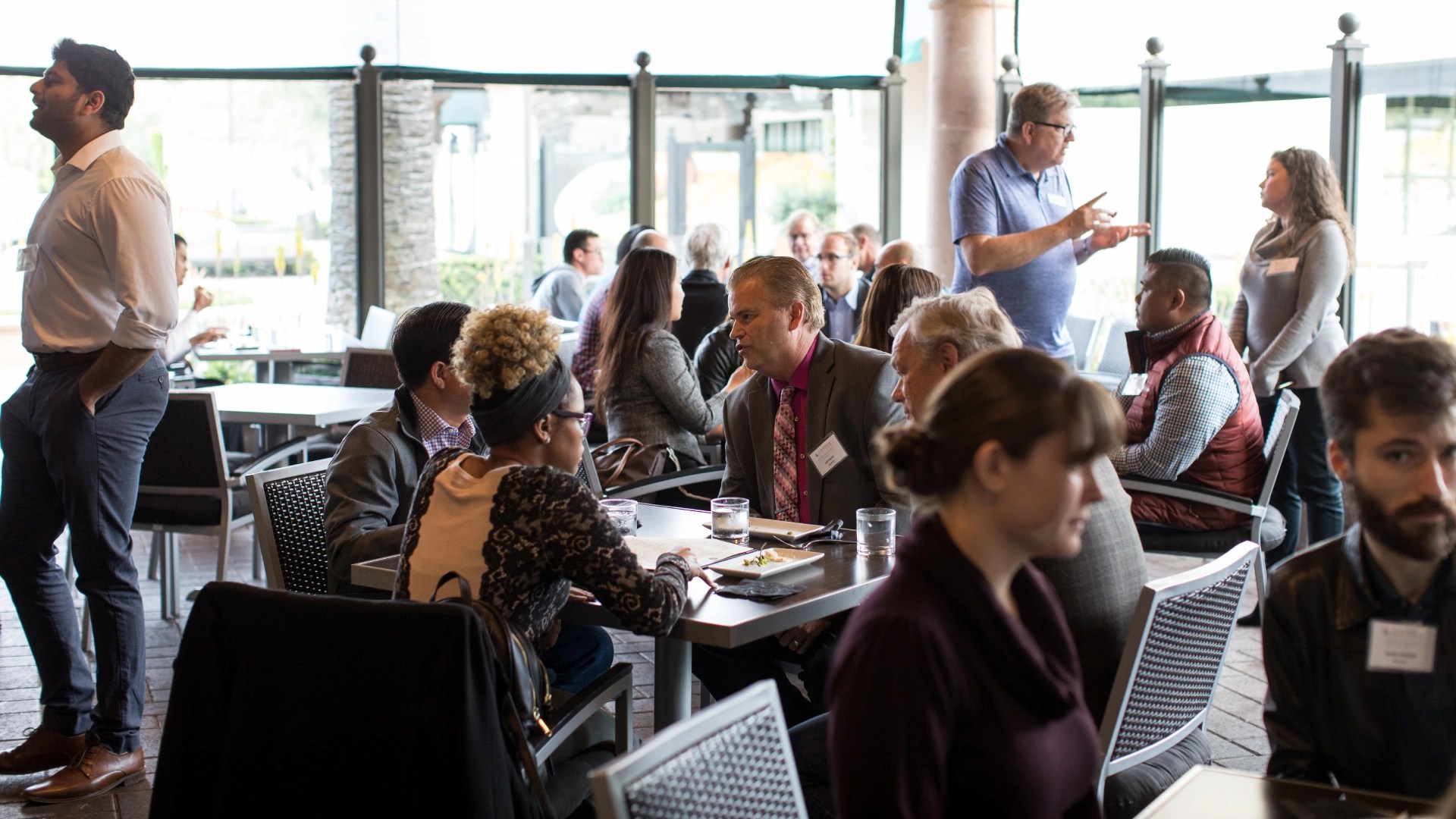 A group of people sitting at tables
