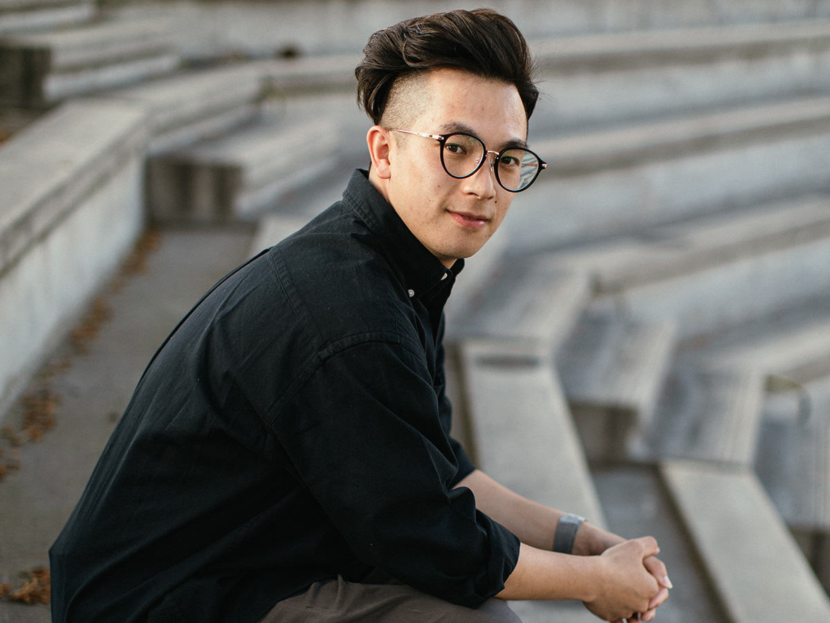 A man sitting on a bleachers
