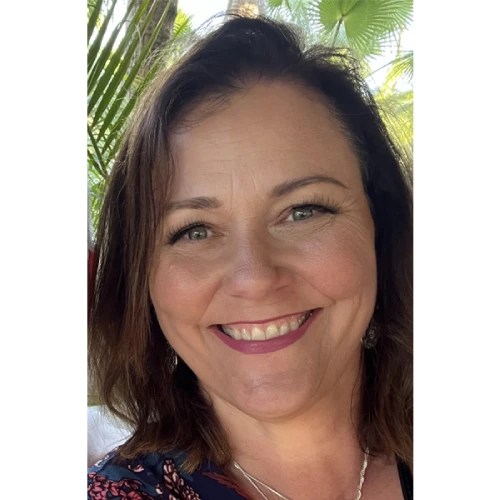 A woman smiling for the camera