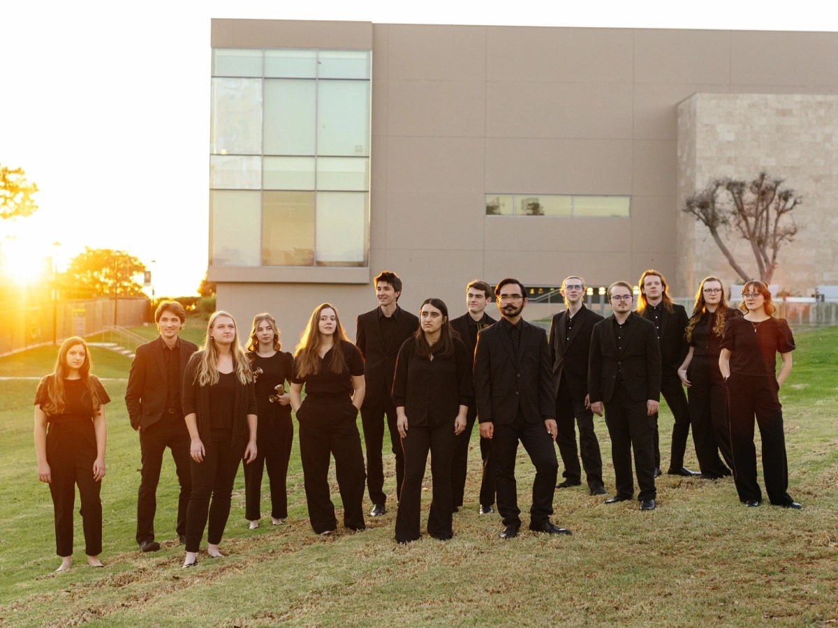 A group of people standing in front of a building