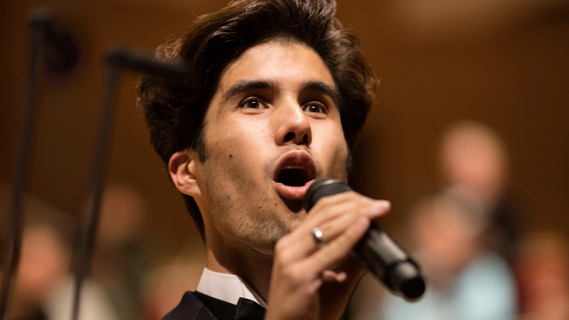 A man singing into a microphone