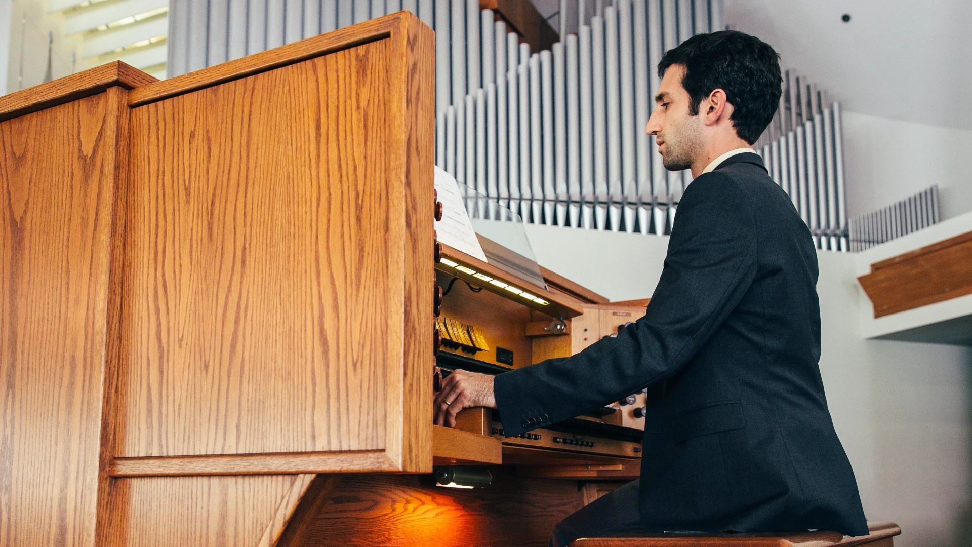 A man playing a organ
