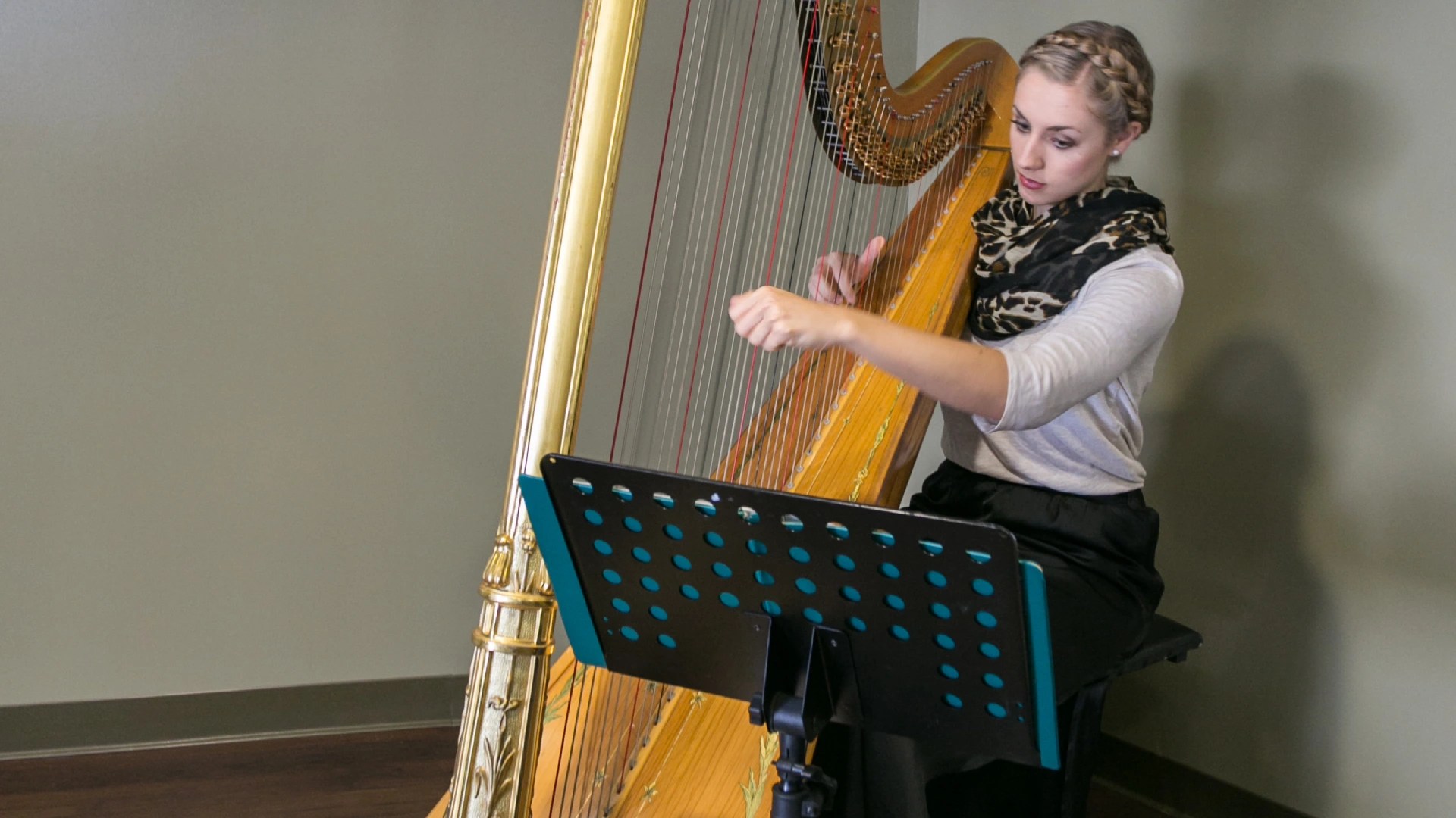 A woman playing a harp