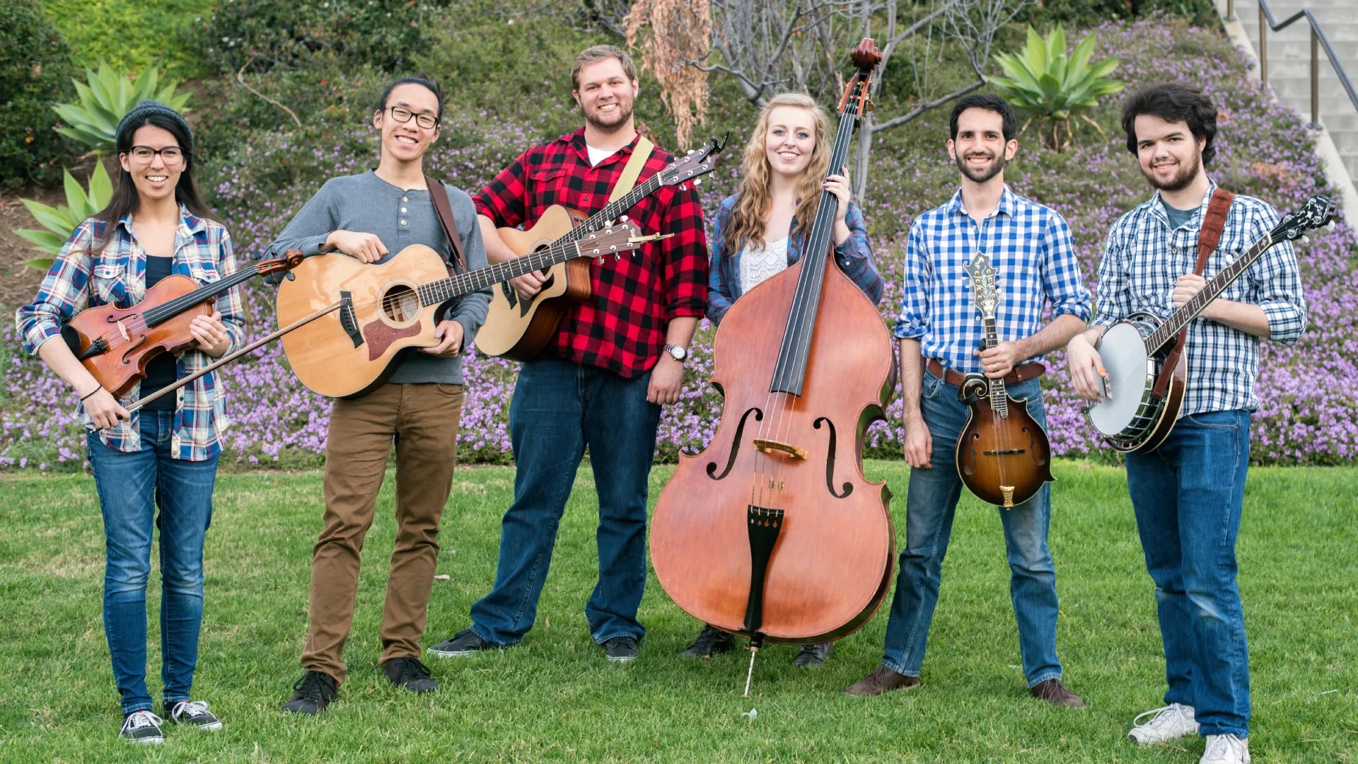 A group of people holding musical instruments