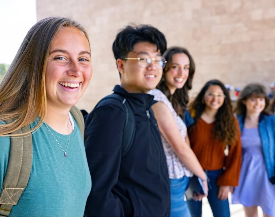 Group of Concordia University Irvine students smiling outdoors on campus