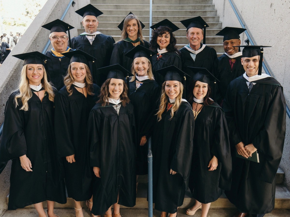 A group of people in graduation gowns and caps
