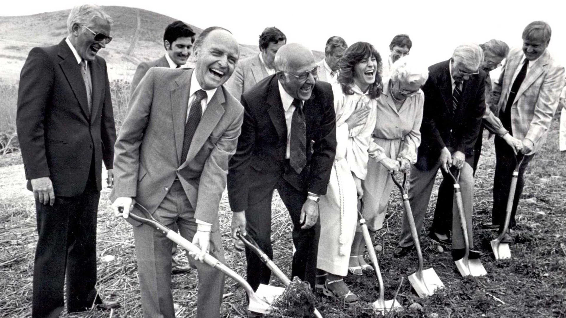 A group of people digging a hole