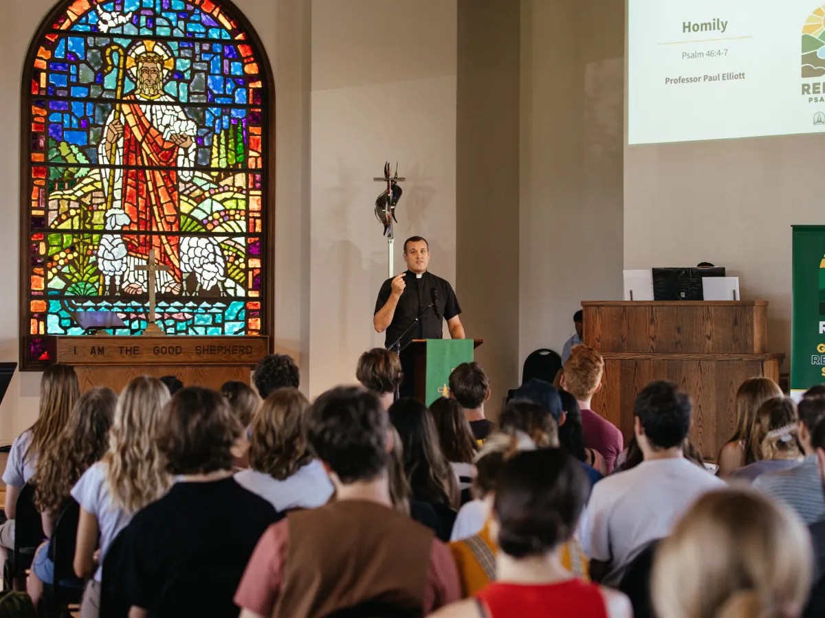 A man standing in front of a crowd of people