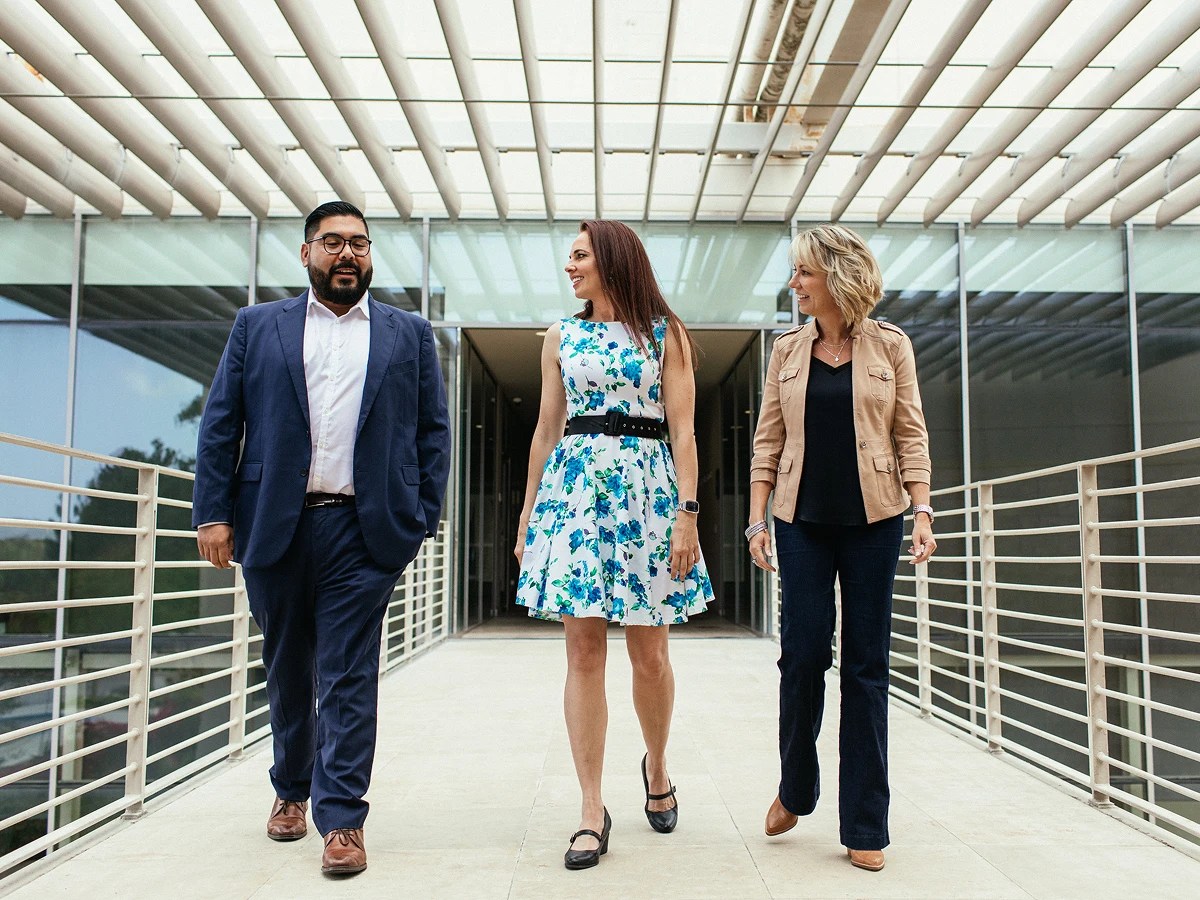A group of people walking on a walkway