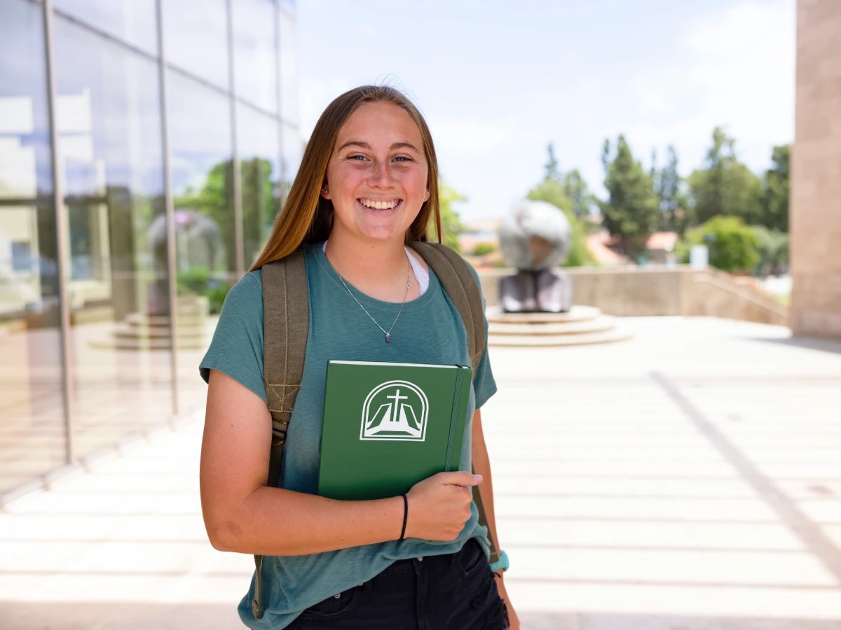 A girl holding a book