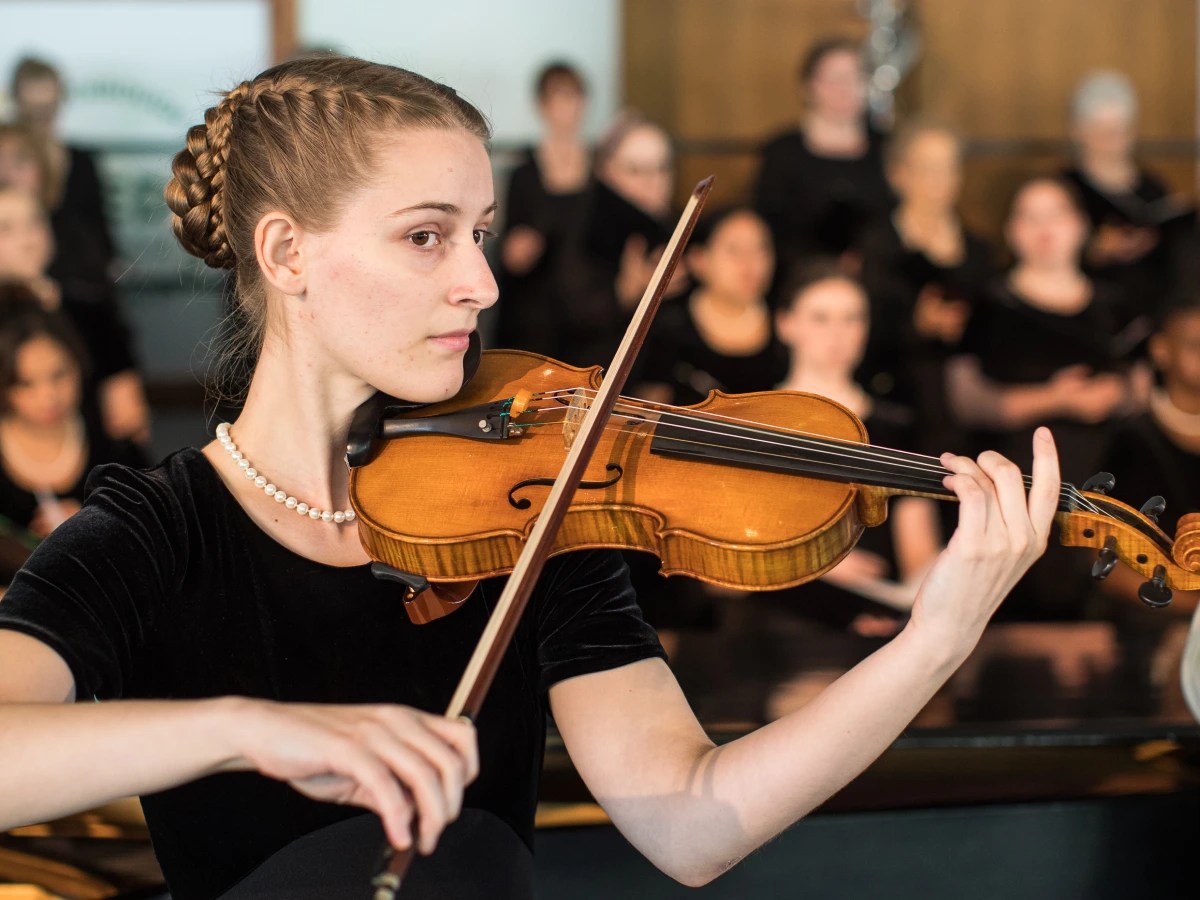 A woman playing a violin