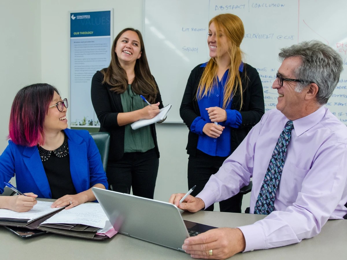 A group of people in a meeting