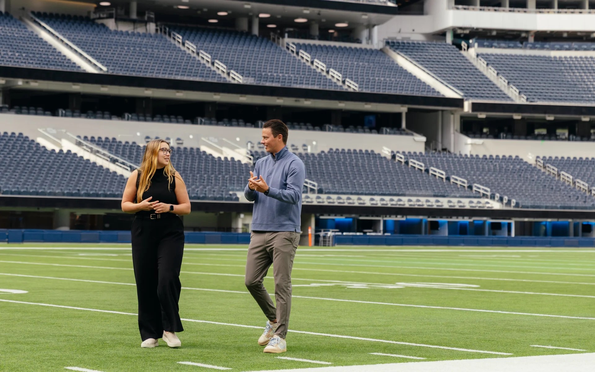 A man and woman on a football field
