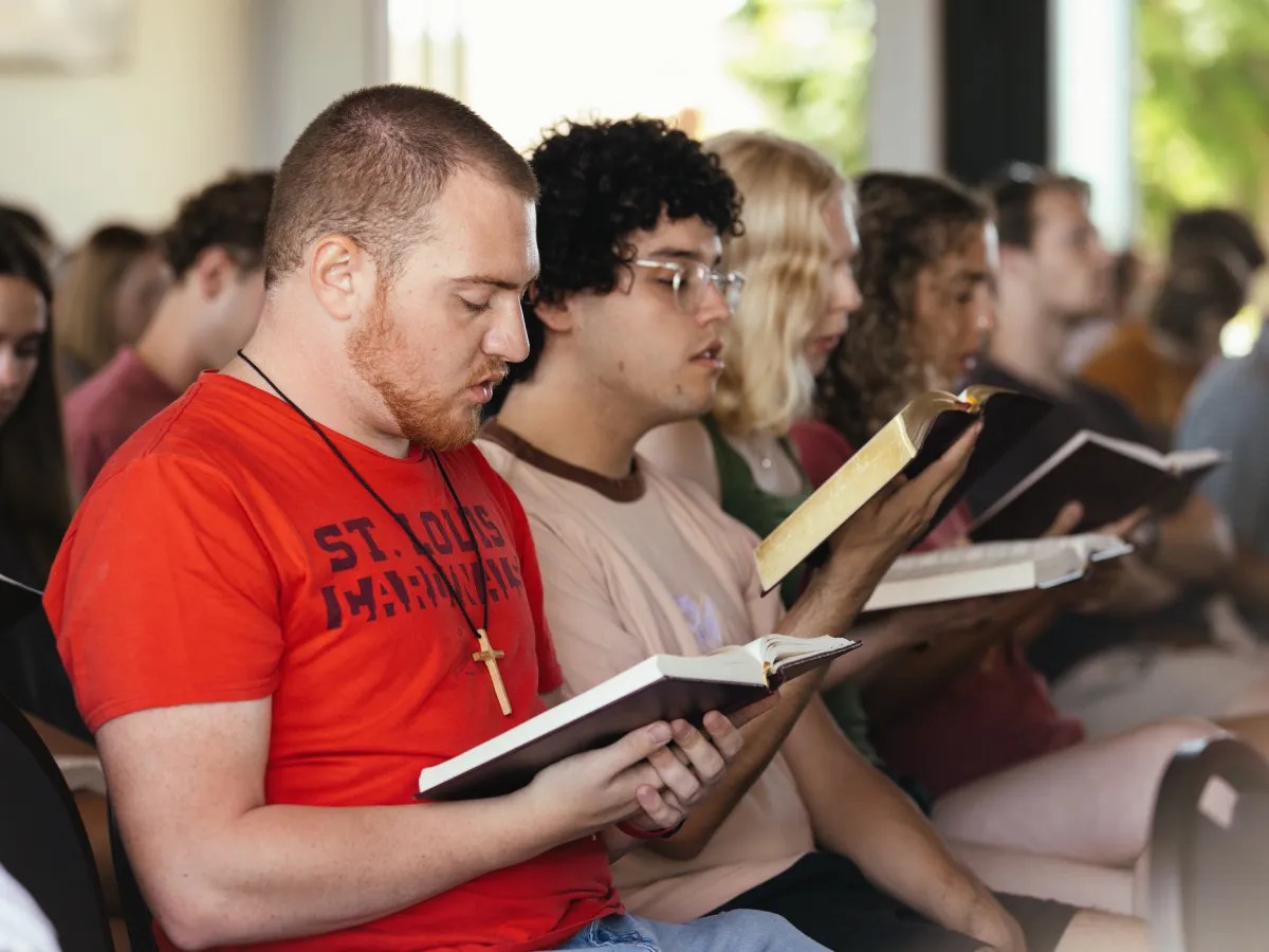 A group of people reading books