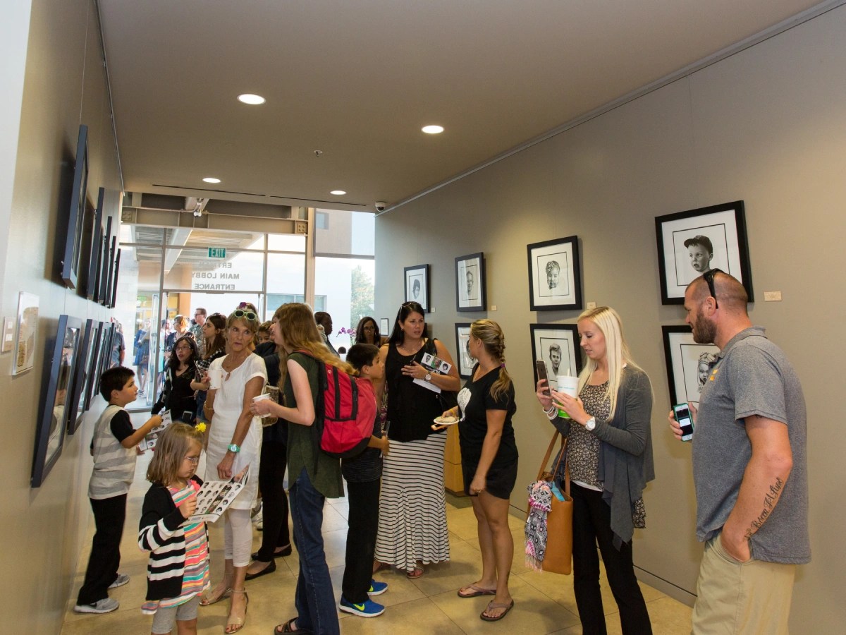 A group of people standing in a hallway