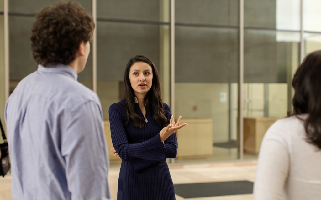 A woman talking to a man